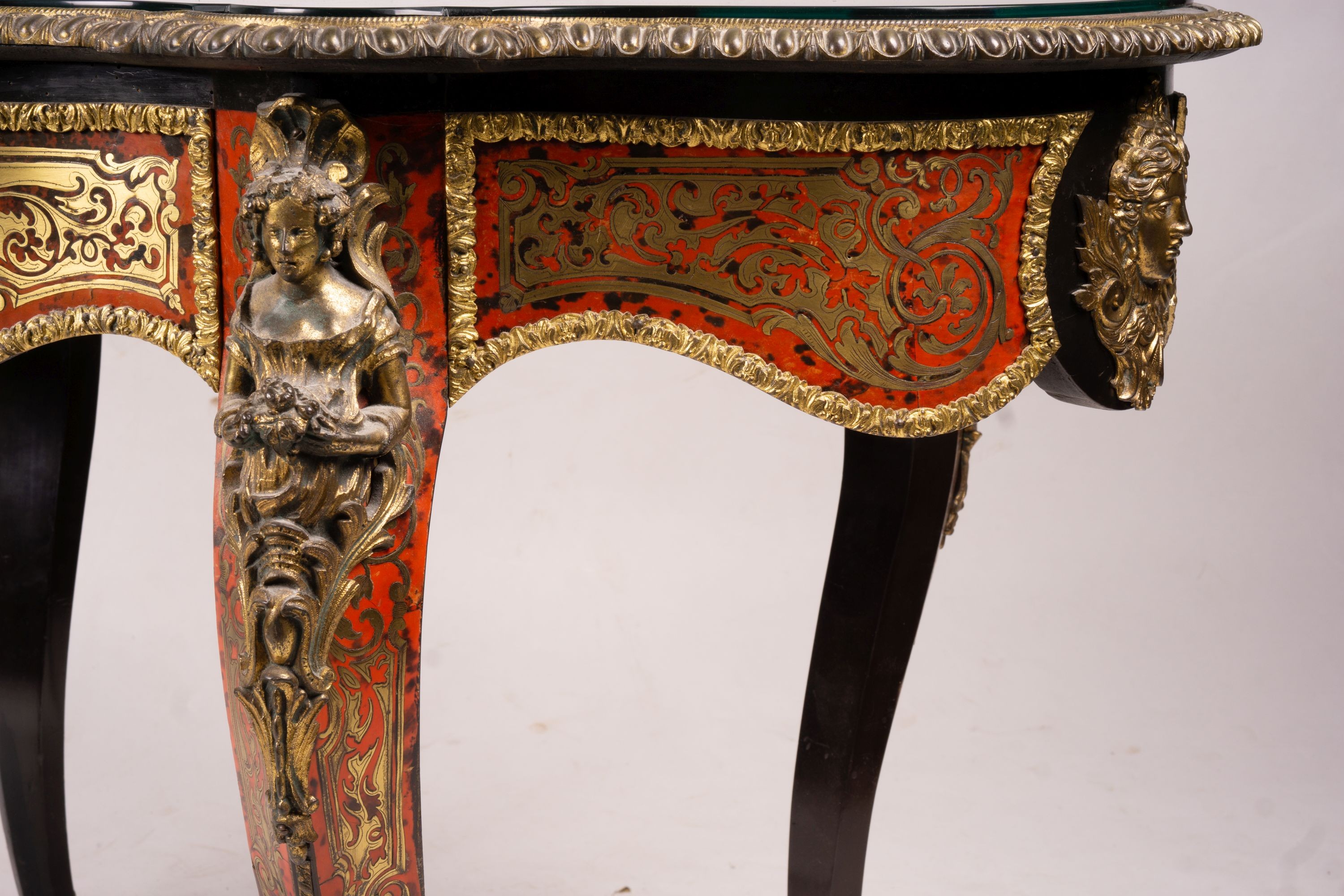 A 19th century Boulle inlaid centre table with shaped oval top, width 130cm, depth 78cm, height 76cm